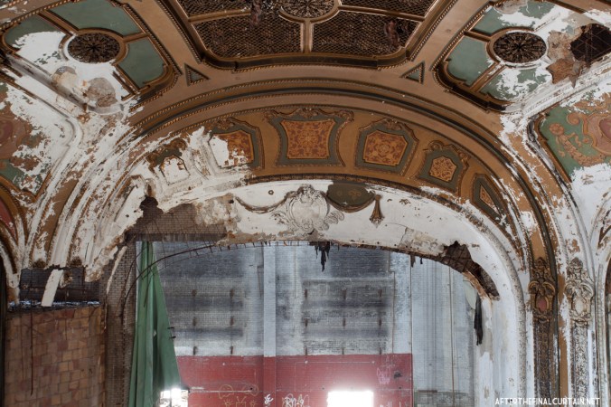 The proscenium arch has become water damaged in the years since the theater closed.
