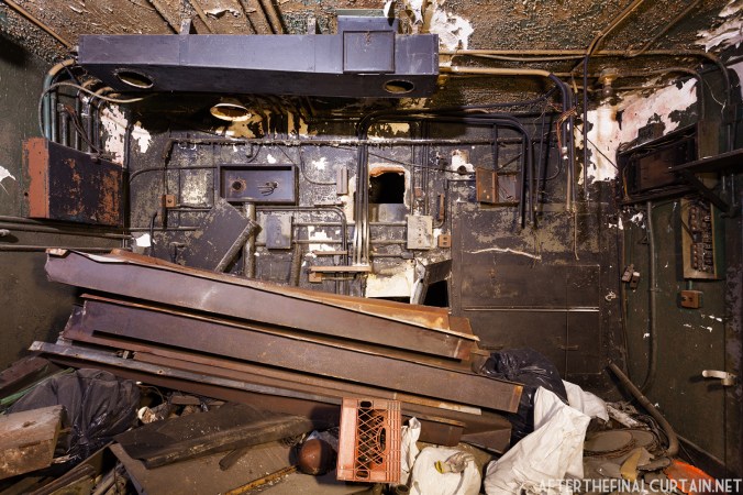 The interior of the projector room is full of construction debris.