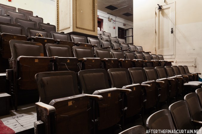 If you look closely you can see the old hat racks on the bottom of the seats.