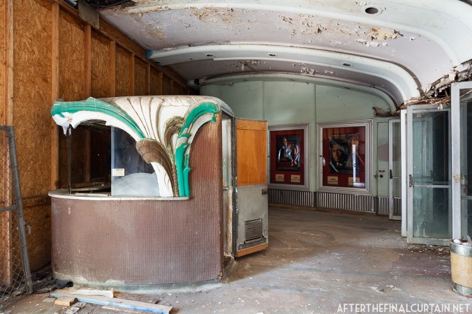 The original ticket booth has been protected from the elements by a plywood wall.