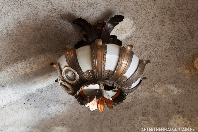 A close up of one of the original light fixtures in the lobby.