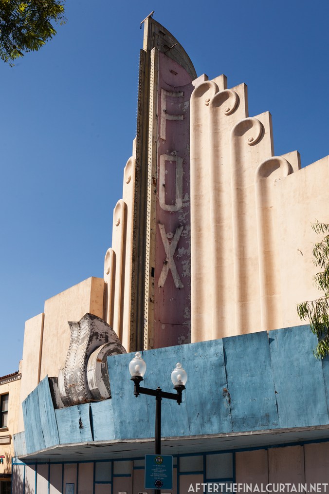 The marquee is also partially protected by a plywood barrier. 